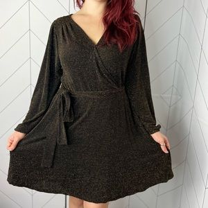 Black and gold women’s dress with tie at waist